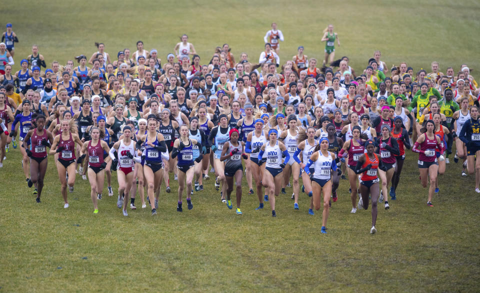 FILE - Runners compete in the women's NCAA Division I Cross-Country Championships, Saturday, Nov. 23, 2019, in Terre Haute, Ind. The number of women competing at the highest level of college athletics continues to rise along with an increasing funding gap between men’s and women’s sports programs, according to an NCAA report examining the 50th anniversary of Title IX. (AP Photo/Doug McSchooler, File)