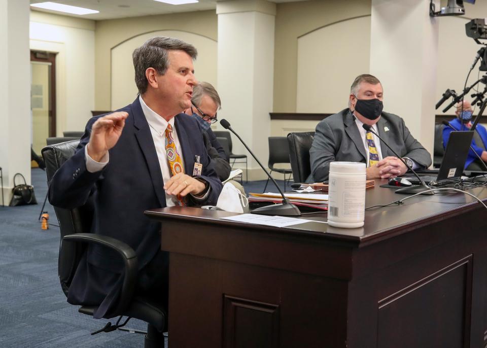 Brent McKim with the Jefferson County Teachers Association, speaks in a committee hearing about a new pension proposal for new teachers on Thursday, February 4, 2021.  At the table, right, is representative C. Ed Massey who sponsored the bill.