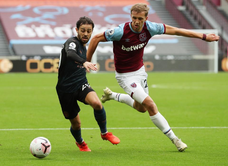 Manchester City's Bernardo Silva (left) in action with West Ham United's Tomas Soucek.