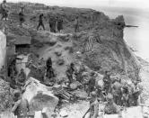 A U.S. flag lies as a marker on a destroyed bunker two days after the strategic site overlooking D-Day beaches was captured by U.S. Army Rangers at Pointe du Hoc, France, on June 8, 1944. The gun emplacement was captured by seaborne Rangers, who arrived in the early hours of D-Day to find that the German artillery it housed had been moved inland. The guns were later located and destroyed. (Photo: U.S. National Archives/handout via Reuters)