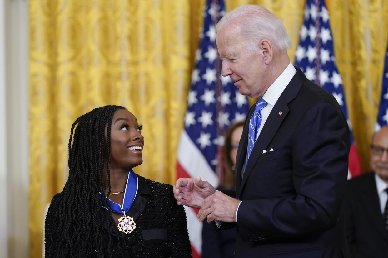 President Joe Biden awards the nation's highest civilian honor, the Presidential Medal of Freedom, to gymnast Simone Biles during a ceremony in the East Room of the White House in Washington, Thursday, July 7, 2022. 