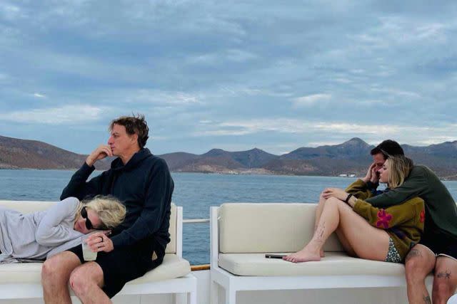 <p>France Bean Cobain/Instagram</p> Catherine Goodman (left), Tony Hawk, Frances Bean Cobain and Riley Hawk photographed on a boat
