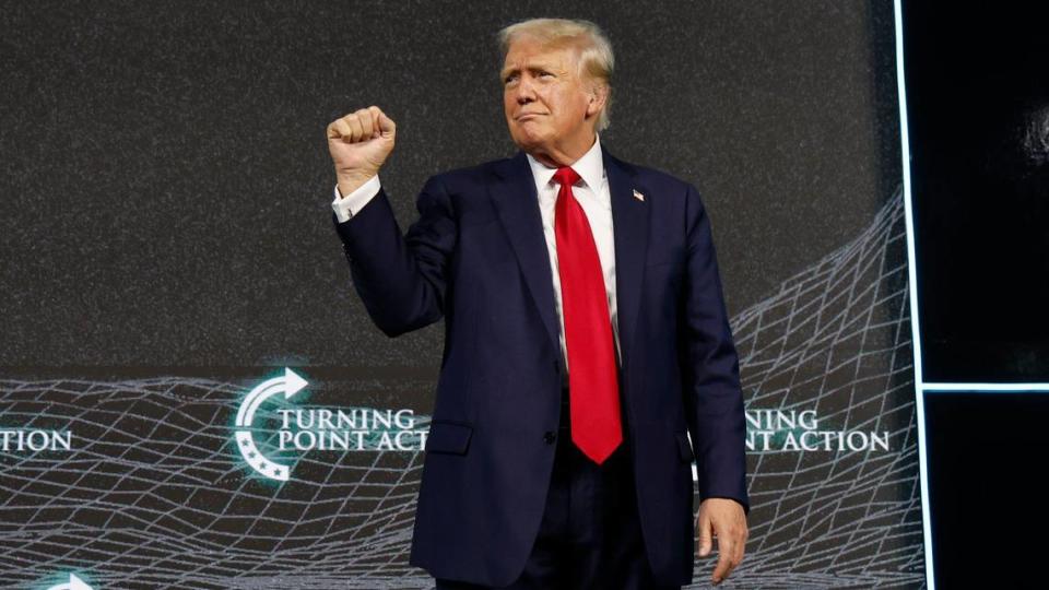 Former President Donald Trump pumps his fist during the Turning Point Action Believers’ Summit at the Palm Beach County Convention Center on Friday, July 26, 2024.