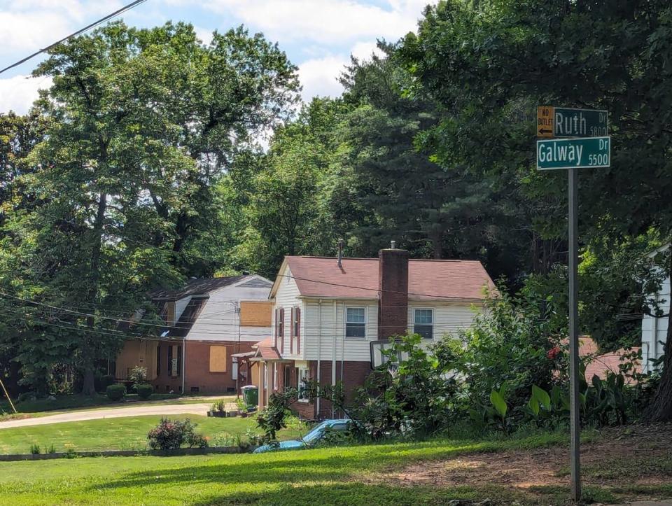 After a deadly shootout with police erupted April 29 at a Galway Drive house in east Charlotte, the front of the badly damaged home and its windows are boarded up on May 21, 2024.