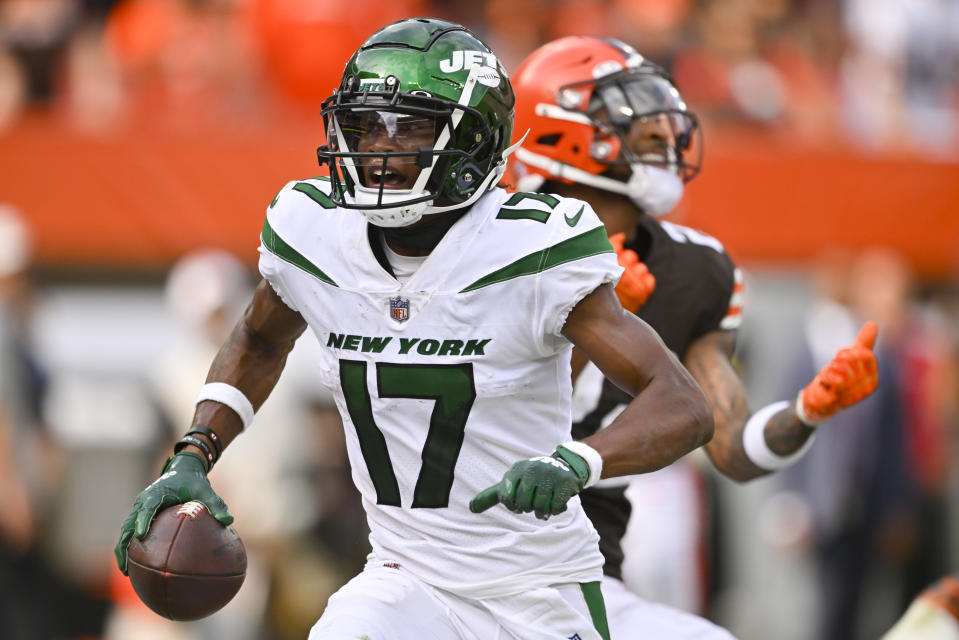 New York Jets wide receiver Garrett Wilson (17) celebrates past Cleveland Browns safety Grant Delpit (22) after scoring a touchdown during the second half of an NFL football game, Sunday, Sept. 18, 2022, in Cleveland. The Jets won 31-30. (AP Photo/David Richard)