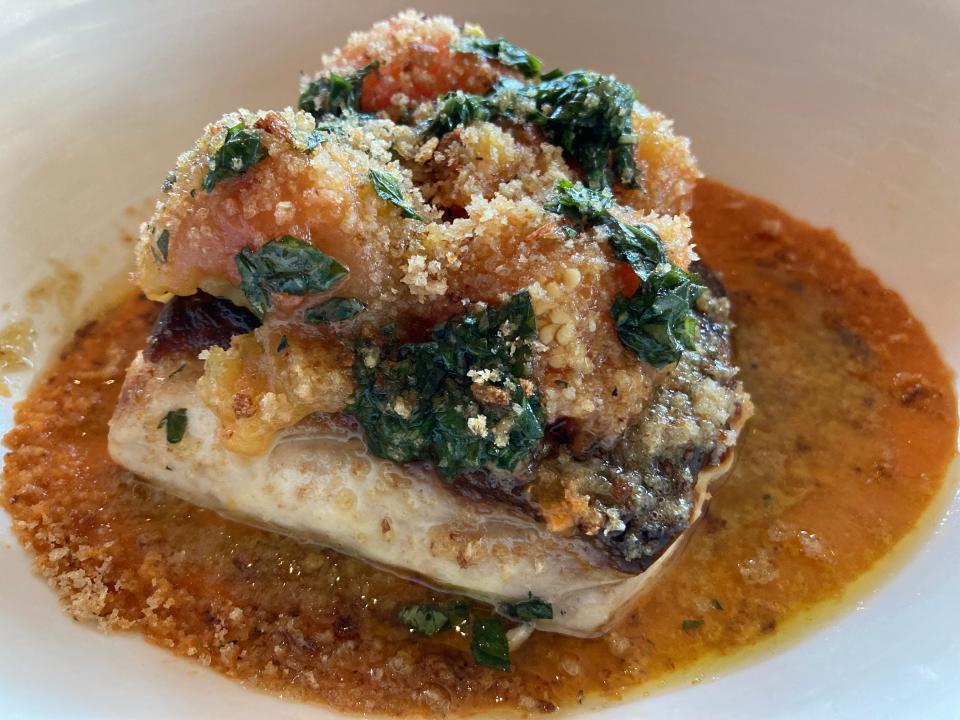 Striped bass with preserved tomato, confit cherry tomato, basil and breadcrumbs, shown June 29, 2023 at Hen of the Wood in Waterbury.