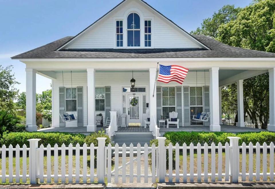 Crane Builders won the award for historical preservation residential with this home complete with a white picket fence.