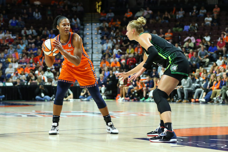 Connecticut Sun forward Alyssa Thomas looks to move the ball around Minnesota Lynx forward Dorka Juhasz during Game 1 of their first-round 2023 WNBA playoffs series on Sept. 13, 2023, at Mohegan Sun Arena in Uncasville, Connecticut. (M. Anthony Nesmith/Icon Sportswire via Getty Images)