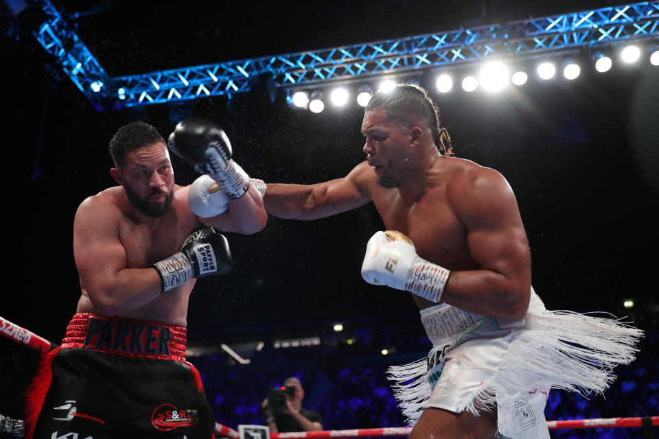 Joe Joyce (R) punches Joseph Parker during the WBO Interim World Heavyweight Championship fight on Sept. 24 at AO Arena in Manchester, England. (Photo by Alex Livesey/Getty Images)