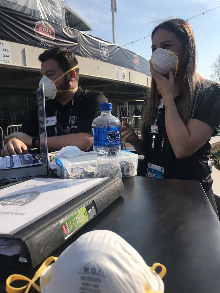 Oakland Alameda Coliseum employees are required to wear masks to protect them from Sunday’s smoky conditions. (Heidi Fang/Twitter)