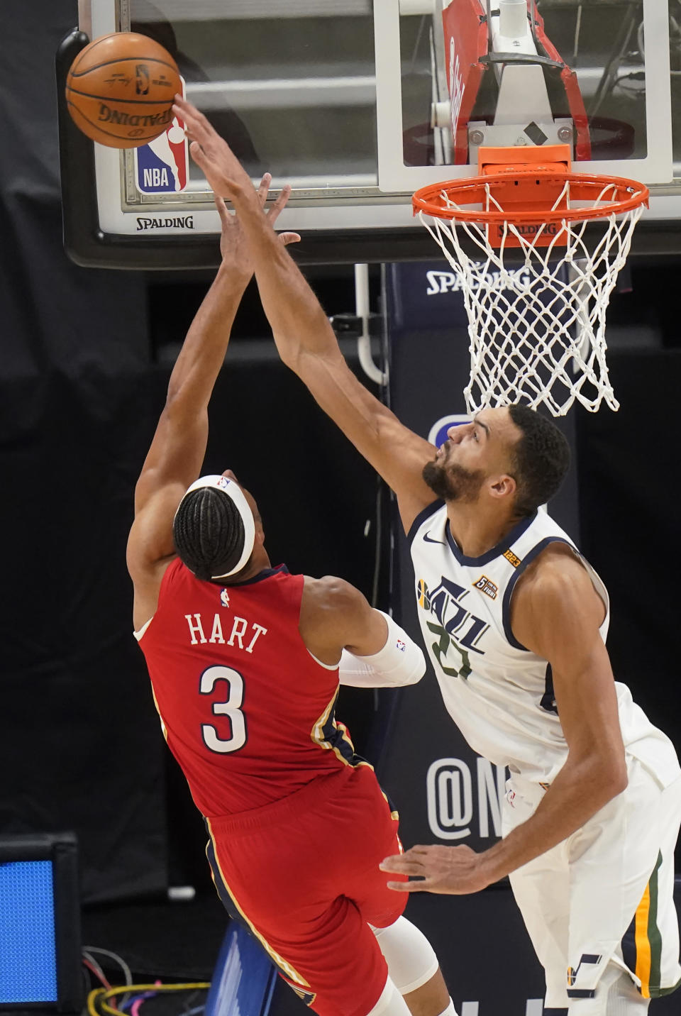 Utah Jazz center Rudy Gobert (27) blocks the shot of New Orleans Pelicans guard Josh Hart (3) during the second half of an NBA basketball game Thursday, Jan. 21, 2021, in Salt Lake City. (AP Photo/Rick Bowmer)