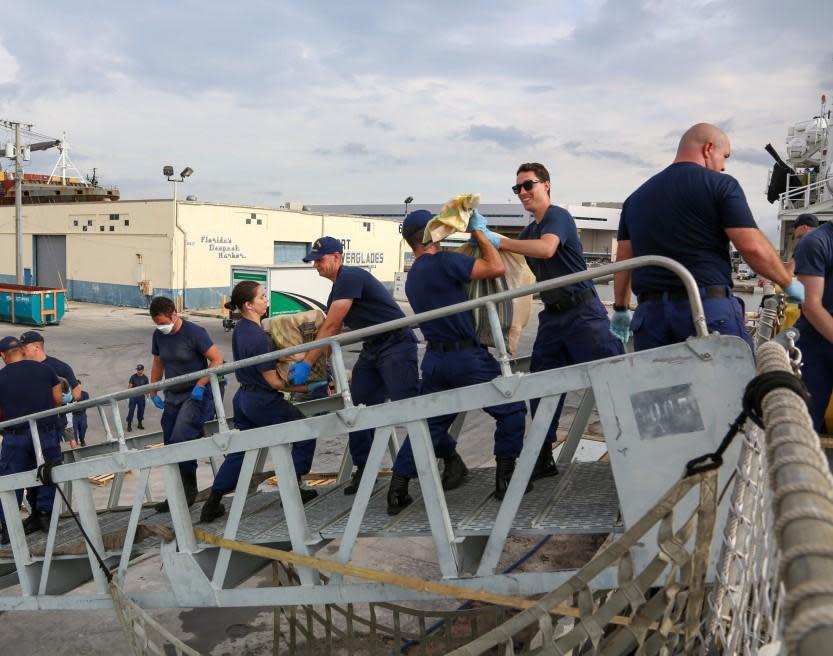 Coast Guard Cutter Tahoma's crew offloads more than 7,500 pounds of cocaine, an estimated street value of $143.5 million, at Port Everglades, in Fort Lauderdale, Florida, on June 14, 2021.  / Credit: U.S. Coast Guard photo by Chief Petty Officer Charly Tautfest