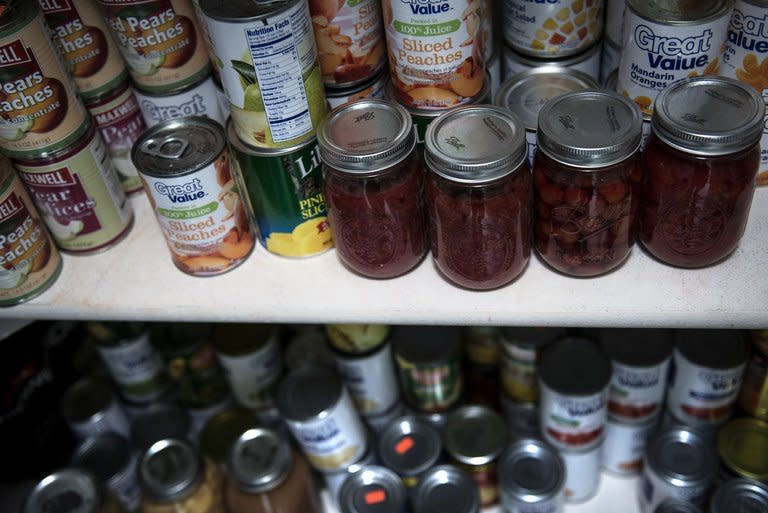 Canned food, including preserves from fruit grown on Jay Blevins' property, is seen in a pantry on December 5, 2012 in Berryville, Virginia. The Mayan end of the world is the last thing on his mind, but if it happens, he and his family are more than ready for it