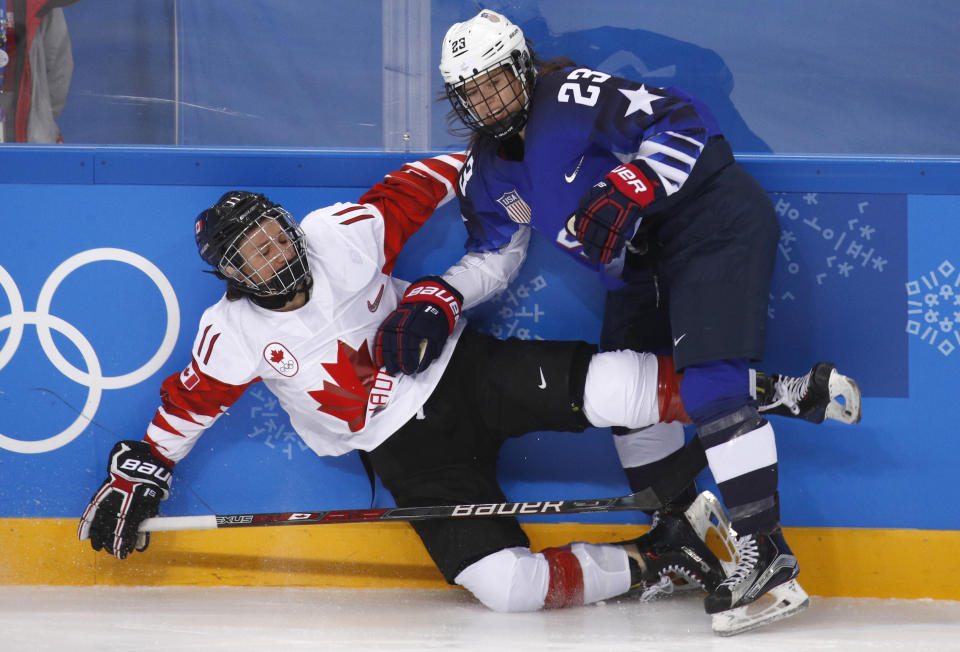 <p>Sidney Morin (23), of the United States, checks Jillian Saulnier (11), of Canada, during the second period of the women’s gold medal hockey game at the 2018 Winter Olympics in Gangneung, South Korea, Thursday, Feb. 22, 2018. (AP Photo/Jae C. Hong) </p>