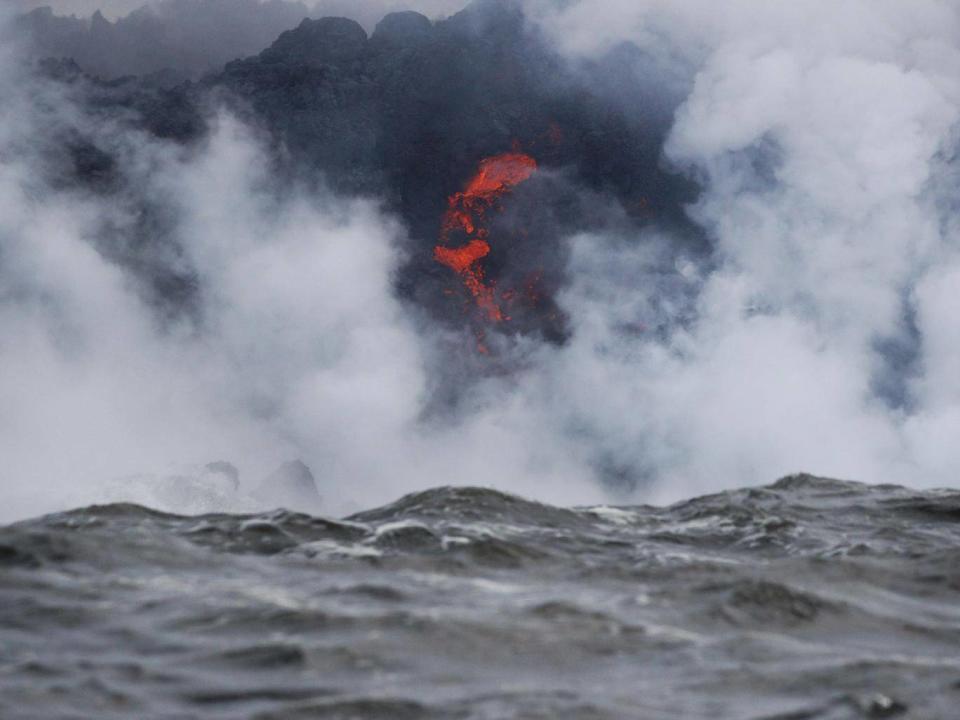 Lava flows into the ocean near Pahoa, Hawaii (AP Photo/Jae C Hong)