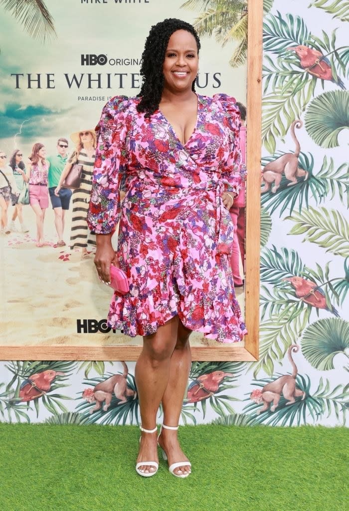 Natasha wearing a floral short dress at a press event for her show White Lotus