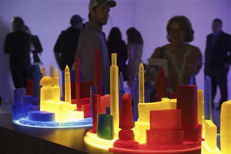 People view art pieces based on the bottle city of Kandor during an exhibition of work by the late artist Mike Kelley, during a media preview at The Geffen Contemporary at The Museum of Contemporary Art (MOCA) in Los Angeles, California March 28, 2014. REUTERS/Jonathan Alcorn