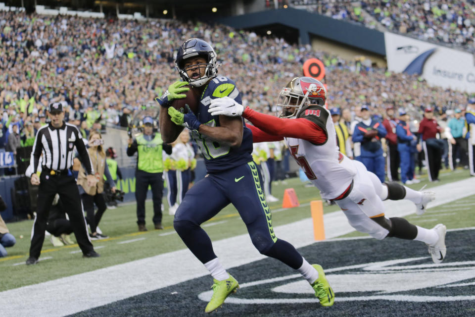 A little less than two weeks after terrible swelling from a shin bruise, Seattle's Tyler Lockett is expected to play on Sunday. (AP/John Froschauer)