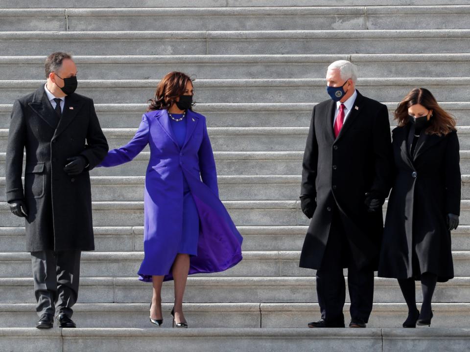 Former Vice President Mike Pence, his wife Karen Pence, the new Vice President Kamala Harris, and her husband Doug Emhoff walk down the stairs after the inauguration. Mr Pence attended the ceremony but not Donald Trump who left Washington before the ceremony beganREUTERS