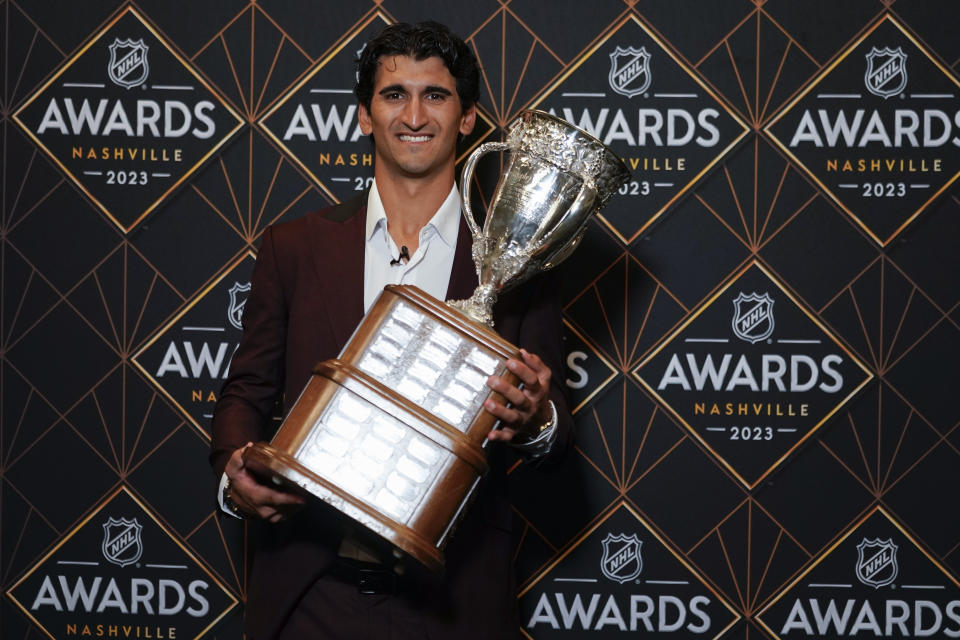 Seattle Kraken hockey player Matty Beniers poses after winning the Calder Memorial Trophy at the NHL Awards, Monday, June 26, 2023, in Nashville, Tenn. (AP Photo/George Walker IV)