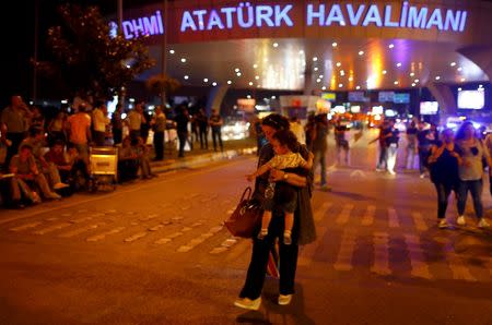 People leave Turkey's largest airport, Istanbul Ataturk, Turkey, following a blast June 28, 2016. REUTERS/Osman Orsal