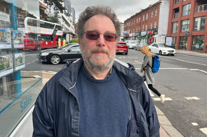 Simon Winston pictured in Finchley with traffic in the background