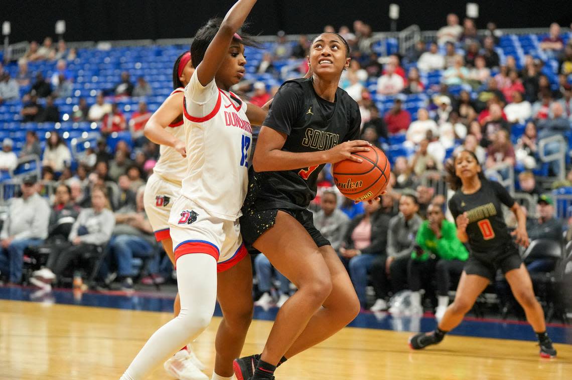 South Grand Prairie’s Taylor Barnes (3) looks for a shot over Kaylinn Kemp (12) of Duncanville in the Class 6A state championship game on Saturday, March 2, 2024 at the Alamodome in San Antonio, Texas. Duncanville defeated South Grand Prairie 59-41.
