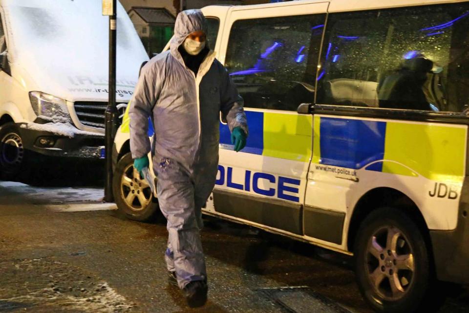 Police at the scene in Hounslow after the victim's body was found (Nigel Howard)