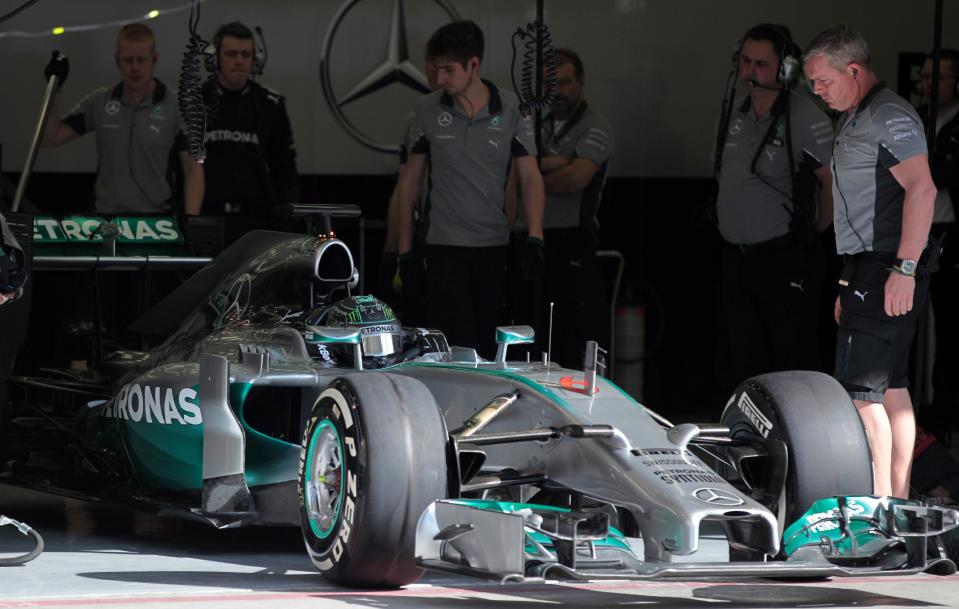 Formula One driver Nico Rosberg of Mercedes heads out of the garage for test laps at the Bahrain International Circuit in Sakhir, Bahrain, Thursday, Feb. 20, 2014. (AP Photo/Hasan Jamali)