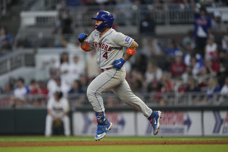 New York Mets' Francisco Alvarez reacts as he rounds the bases after hitting a two-run home run in the fourth inning of a baseball game against the Atlanta Braves, Thursday, June 8, 2023, in Atlanta. (AP Photo/John Bazemore)