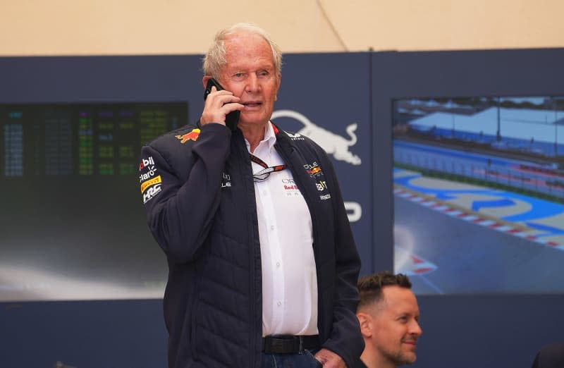Helmut Marko, head of motorsport from the Oracle Red Bull Racing team, is on the phone in the paddock. Hasan Bratic/dpa