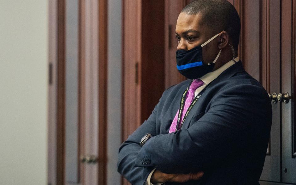 U.S. Capitol Police officer Eugene Goodman watches never-before-seen security footage of rioters storming the Capitol on Jan. 6, during the second day of former President Donald Trump's second impeachment trial, - The New York Times