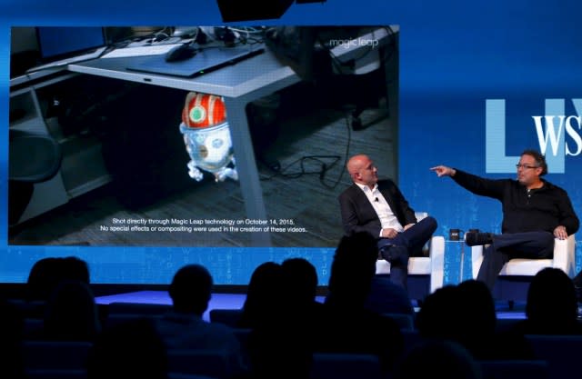 Rony Abovitz, founder president and CEO of Magic Leap (R) unveils a view of his companies augmented reality with Rio Caraeff, chief content officer, at the Wall Street Journal Digital Live ( WSJDLive ) conference at the Montage hotel in Laguna Beach, California  October 20, 2015.      REUTERS/Mike Blake