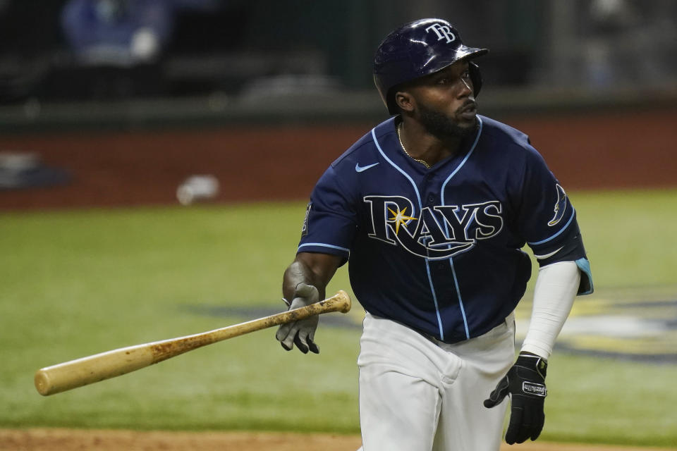 Tampa Bay Rays' Randy Arozarena watches his home run against the Los Angeles Dodgers during the fourth inning in Game 4 of the baseball World Series Saturday, Oct. 24, 2020, in Arlington, Texas. (AP Photo/Eric Gay)