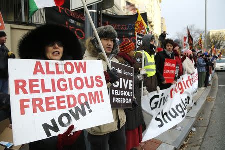 Members of the International Shugden Community rally against the Dalai Lama, who they accuse of religious intolerance, across the street from the site of the National Prayer Breakfast at the Washington Hilton in Washington, February 5, 2015. REUTERS/Jonathan Ernst