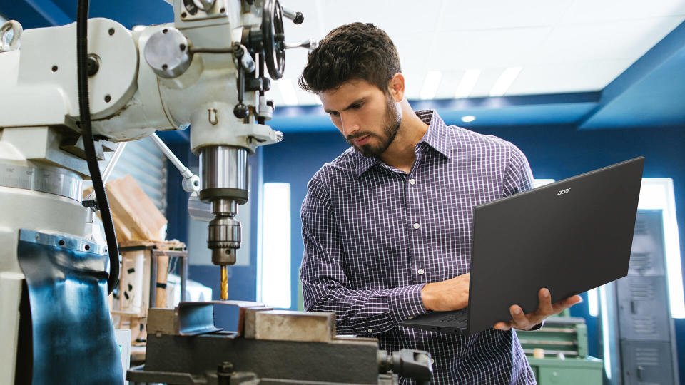 Man using the Acer Swift X 14 (2024) at work.