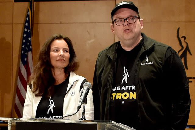 <p>CHRIS DELMAS/AFP via Getty</p> Fran Drescher and Duncan Crabtree-Ireland announce the SAG-AFTRA strike