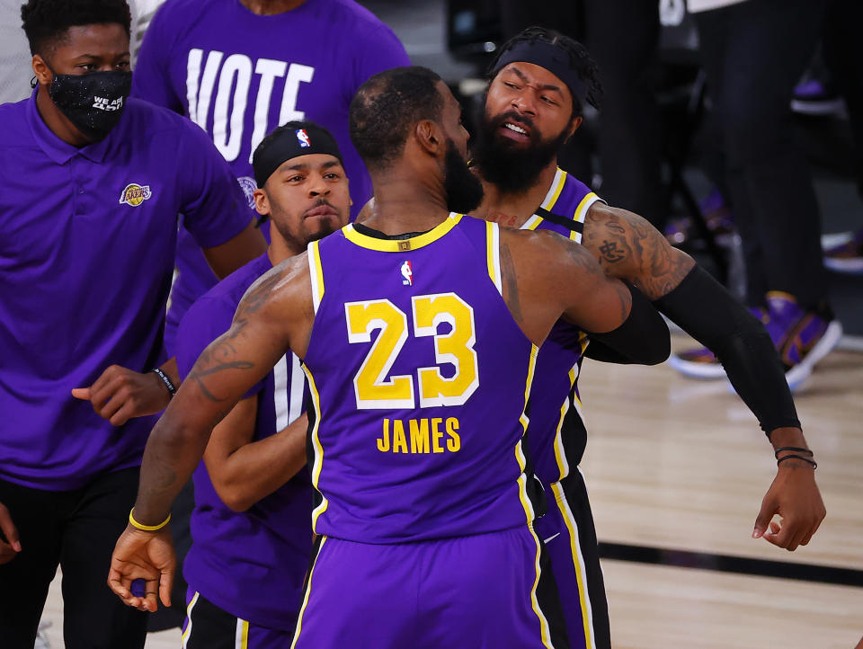 LAKE BUENA VISTA, FLORIDA - SEPTEMBER 26: LeBron James #23 of the Los Angeles Lakers celebrates with teammates during the fourth quarter against the Denver Nuggets in Game Five of the Western Conference Finals during the 2020 NBA Playoffs at AdventHealth Arena at the ESPN Wide World Of Sports Complex on September 26, 2020 in Lake Buena Vista, Florida. NOTE TO USER: User expressly acknowledges and agrees that, by downloading and or using this photograph, User is consenting to the terms and conditions of the Getty Images License Agreement. (Photo by Kevin C. Cox/Getty Images)