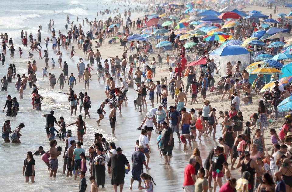 People cool off along the ocean at Santa Monica beach amid an intense heat wave in Southern California on Sept. 4, 2022.