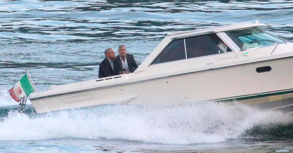 Former President Barack Obama, left, and George Clooney on a boat June 23, 2019.