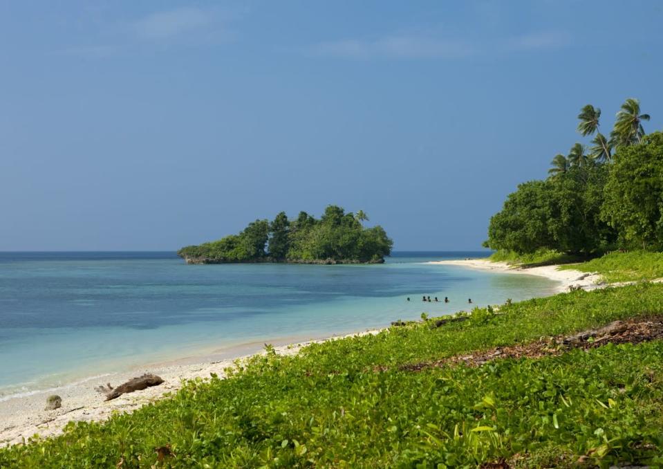 <p>Papua New Guinea has had nearly 50 shark attacks (half of them fatal) .</p>

<p><a href="http://www.theguardian.com/commentisfree/2012/jul/13/shark-attacks-feeding-frenzy-media">The Guardian report</a> that the country has a disproportionately high number of shark attacks, considering its small population size, <span style="font-family:arial, sans-serif;">because of the country's location, with extensive seas coasts and warm climates.</span></p>

<p></p>

<p>Picture: Trobriand Island In Trobriand, Papua New Guinea</p>