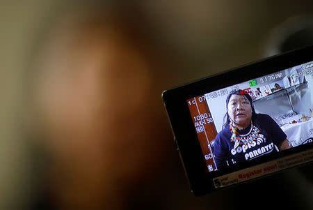 Indian congresswoman Joenia Wapichana is projected on a camera screen as she talks during an interview with Reuters at the Terra Livre camp, or Free Land camp, in Brasilia, Brazil April 25, 2019. REUTERS/Nacho Doce
