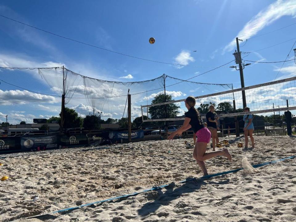 Addison Haskin (black shirt, pink shorts) plays for CLT Beach, a club beach volleyball team based in Charlotte. The club practices at Small Bar in Fort Mill on Monday and Wednesday afternoons.