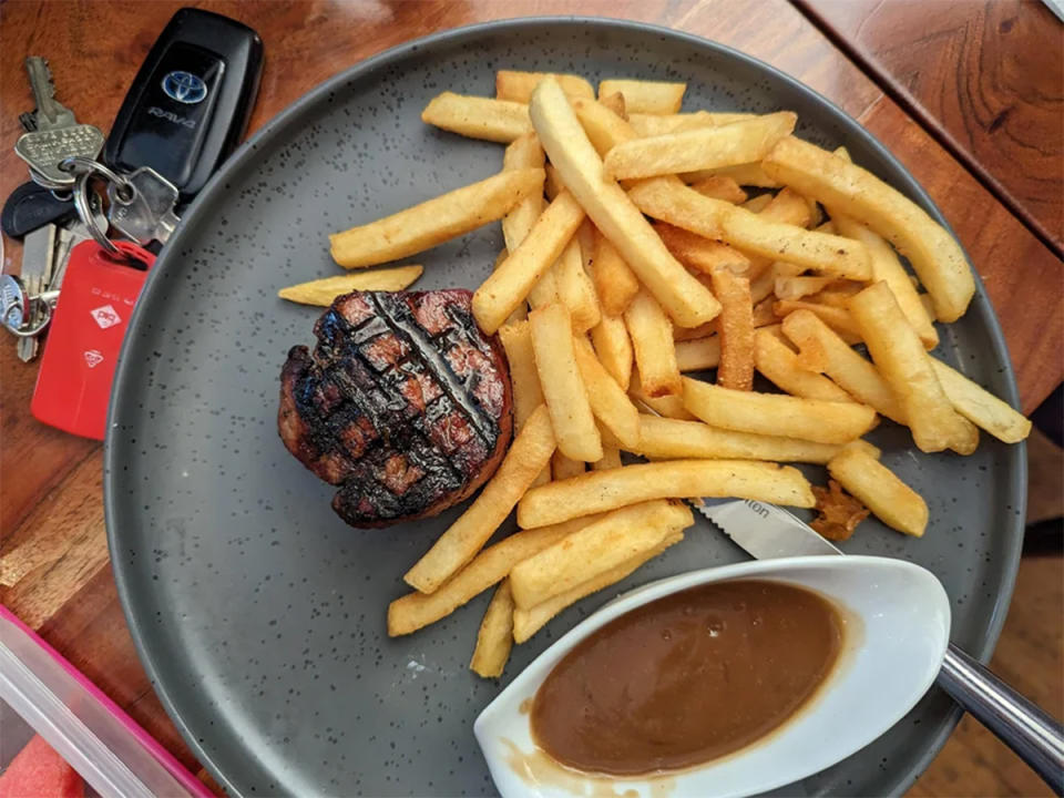 Pub meal of eye fillet steak, chips and gravy