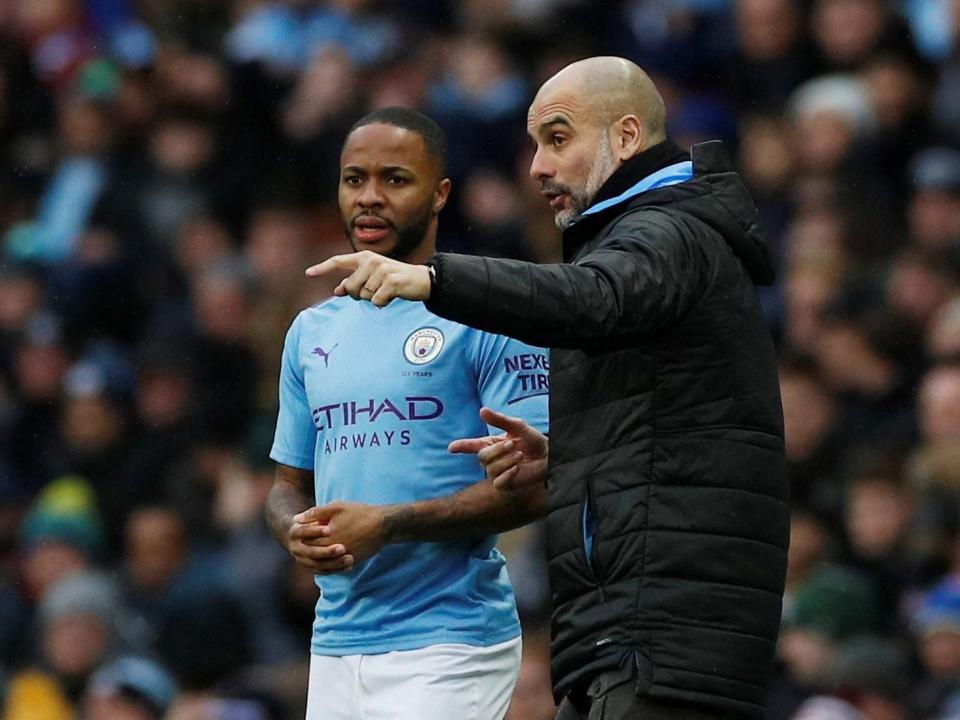 Manchester City's Raheem Sterling receives instructions from manager Pep Guardiola: REUTERS