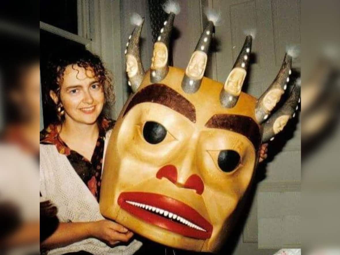 Lucinda Turner is pictured with her artwork, Shaman in a Trance, in 1992. She died at 63 early this week.  (Burke Museum/YouTube - image credit)