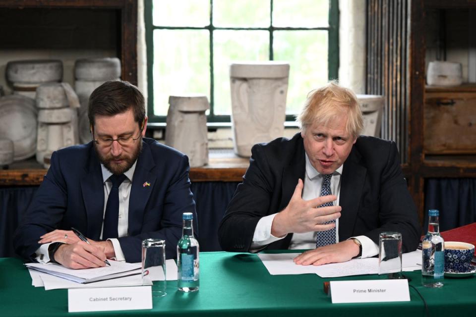 Boris Johnson (right) with cabinet secretary Simon Case (PA)