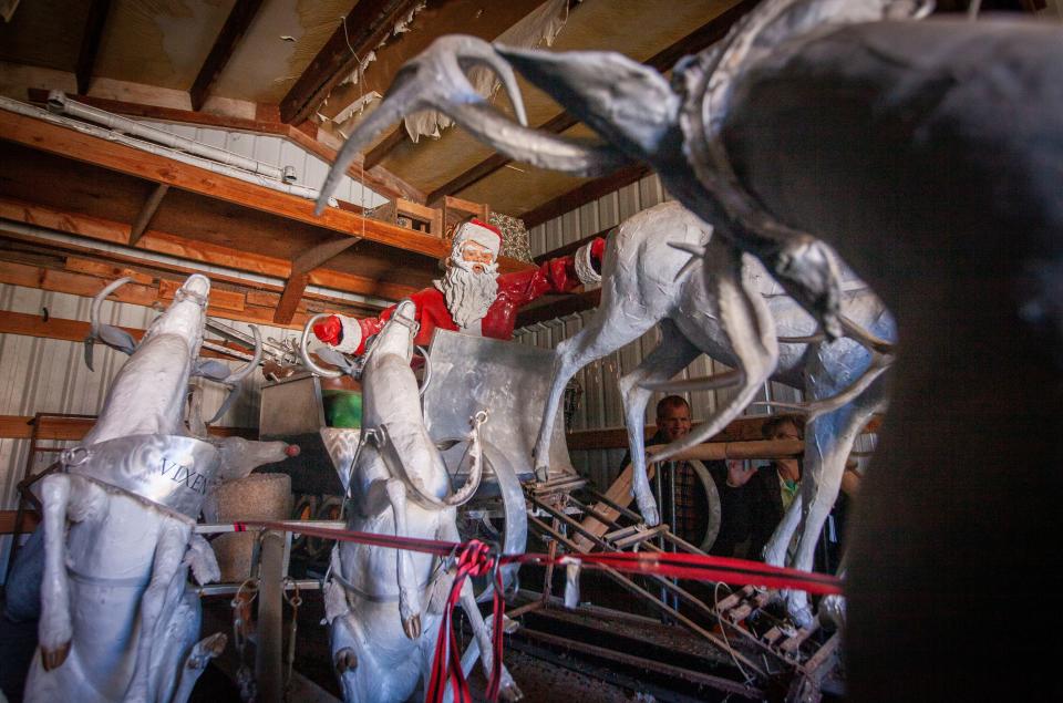 Reindeer, a sleigh and holiday decorations in a shed waiting to be cleaned up for display in 2019 at the Y intersection of Liberty and Commercial streets NE on the outskirts of downtown Salem.