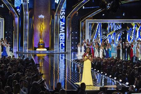 Miss America contestant, Miss New York Nina Davuluri (C) celebrates after being chosen winner of the 2014 Miss America Pageant in Atlantic City, New Jersey, September 15, 2013. REUTERS/Lucas Jackson