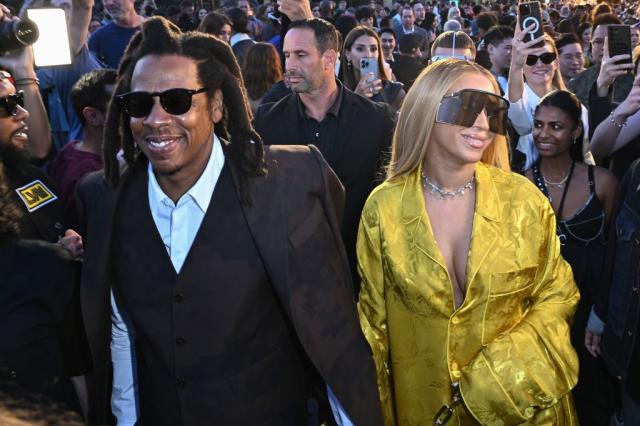 Beyoncé Wears a Fabulous Golden Suit and Iconic Sunglasses to Sit Front-Row  at Louis Vuitton